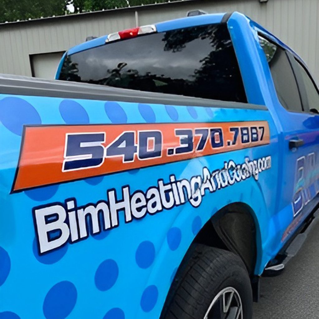 Truck wrap for BIM Heating and Cooling featuring bold blue vinyl with orange accents and clear contact information applied by Core Prints in Fredericksburg, Virginia.