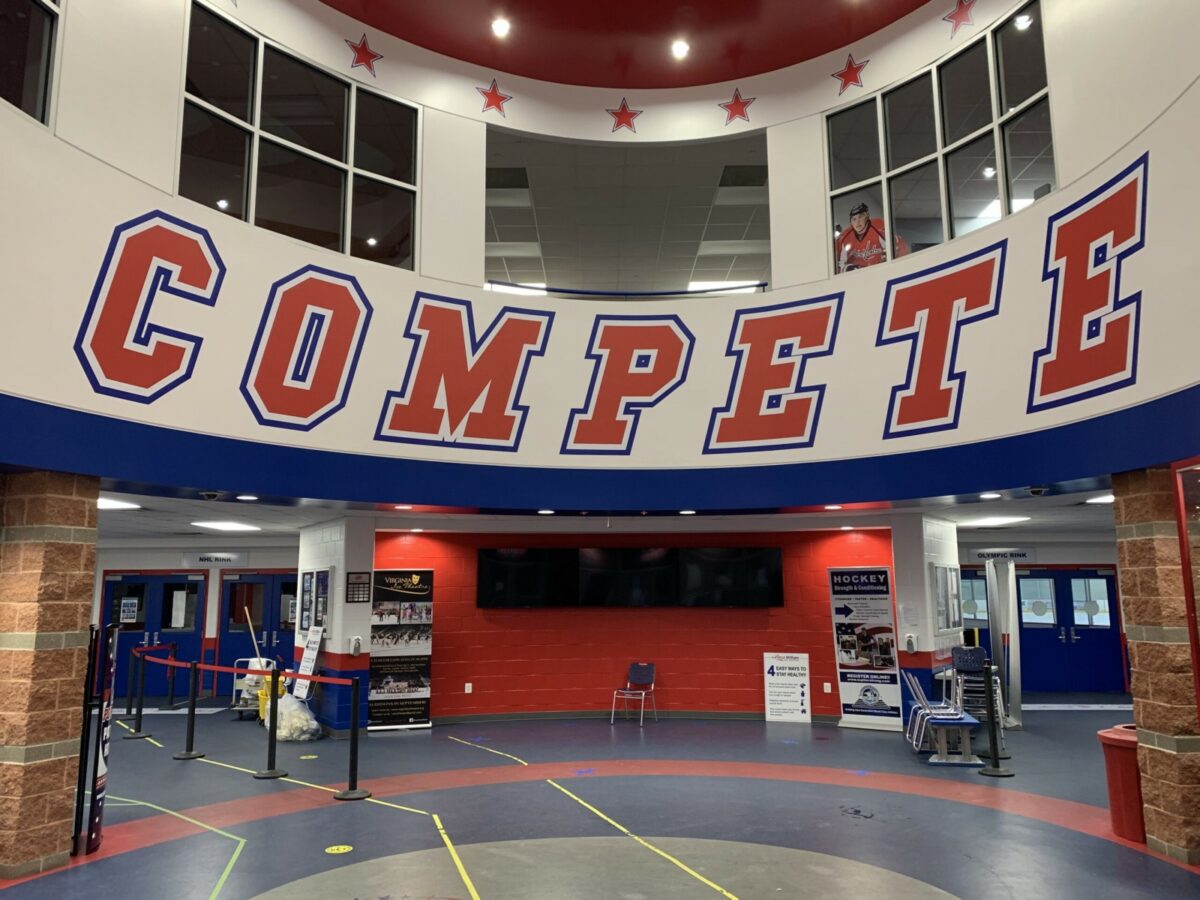Branded wall graphics that say "COMPETE" for Prince William Ice Center, a wall graphics client of Core Prints in Fredericksburg, VA